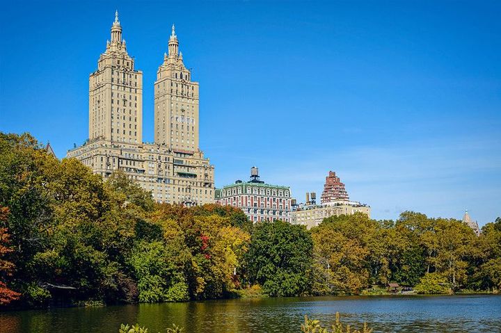 A view of the San Remo building on Central Park West from the Central Park lake.